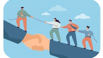 Business team climbing giant handshake with support of leader